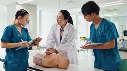 Doctor, students and CPR training in hospital with professional advice, rescue support