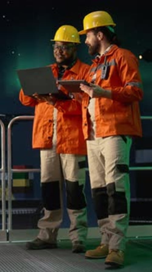 Vertical Video Analyzing Oil Crisis Logistics Laptop and Drilling Barge Engineering Team
