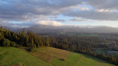 Top View of the Mountains in Shiny Day Cloudy Sky and Forest in Autumn