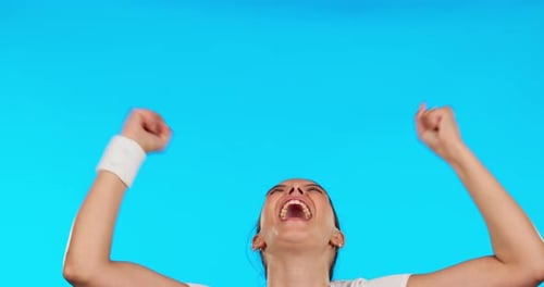 Woman, fist celebration and sports in studio with smile on face for winning