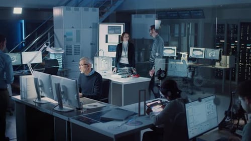 Engineers Collaborating in Modern Technology Research and Development Facility