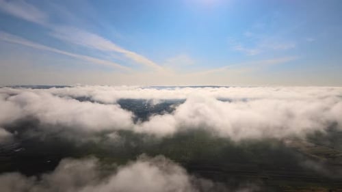 Top View From Above of Landscape Covered with Puffy Morning Fog Cold Humid Air Condensing in Rain