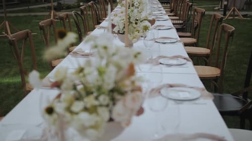 Elegant Wedding Reception Table Setting on Green Lawn