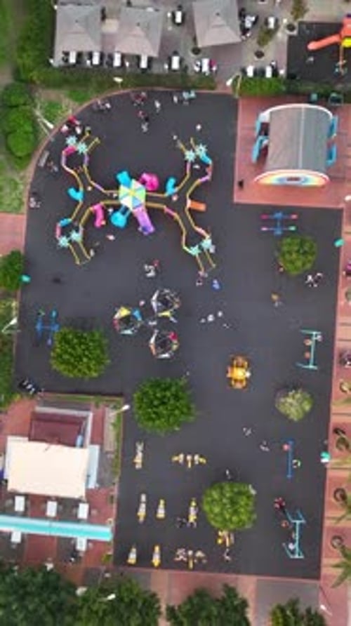 Vertical Video Children Play on the Big Playground Aerial View