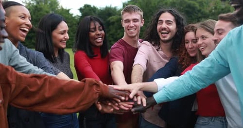 Enthusiastic Young Adults Unite in Green Space