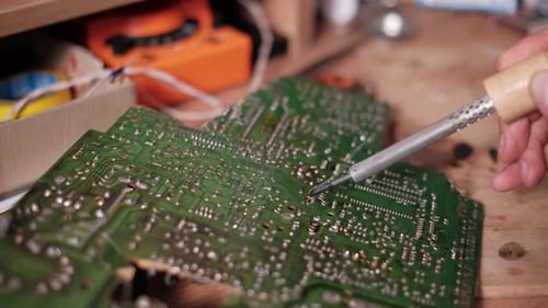 Soldering Circuit Board Close Up in Workshop
