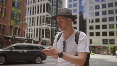 Man Using Smartphone in Urban City Setting