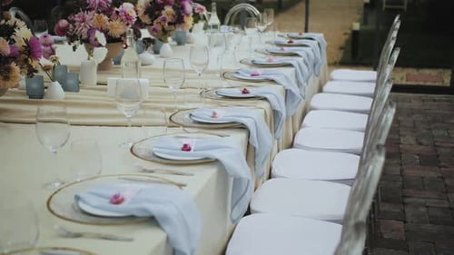 Elegant Wedding Table Setting with Floral Centerpieces