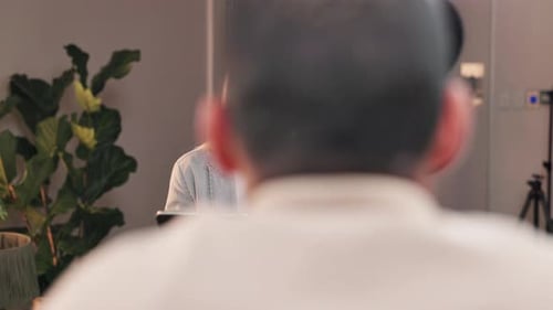 Blonde Woman Interviewing for a Podcast Indoors