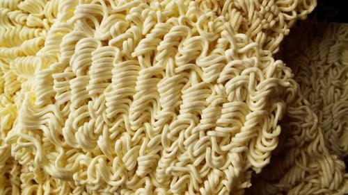 Pile of Dehydrated Ramen Noodles Ready to Be Cooked Top View of Instant Noodle