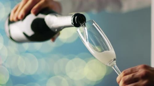 Champagne Pouring into Flute Glass for Celebration