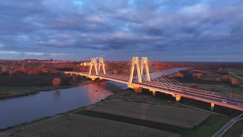 Nighttime Aerial View of Modern Bridge Overhead Shot of Cablestayed Bridge with Lighting at Night