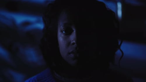 Closeup of Face Young Black Woman Suffering Depression Anxiety Alone at Home in Dark of Night
