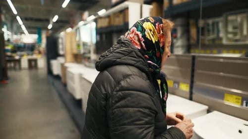 Repair Essentials Join the Older Woman As She Embarks on Her Quest Through the Department Shop