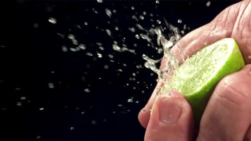 Squeezing Lime Juice with Splashes Filmed on a Highspeed Camera at 1000 Fps