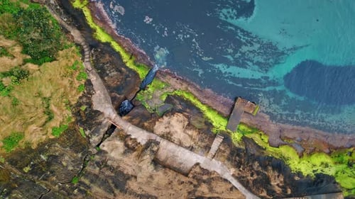 Turquoise Water Washing Coastline Drone Shot Ocean Waves Hitting Rocky Beach