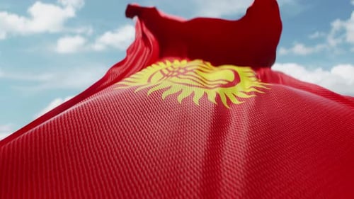 Realistic Waving Flag of Kyrgyzstan on Blue Sky Background