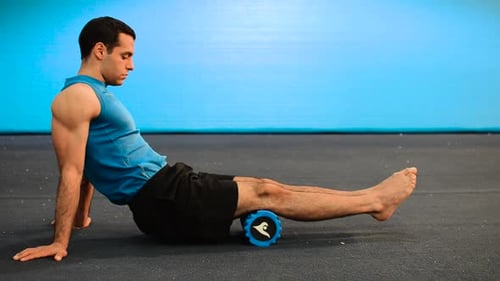 Man Using Foam Roller for Thigh Muscle Recovery