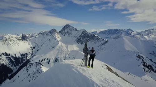 drone shot of a skie hiker on top of the austrian alps