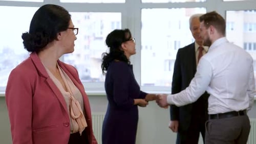 Business Professionals Networking in Modern Office Space