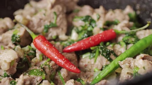 Chicken or Pork Stew with Red and Green Pepper Onion and Spices Cooking in a Frying Pan Traditional