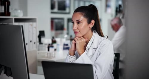 Smiling Woman Working in Medical Research Laboratory