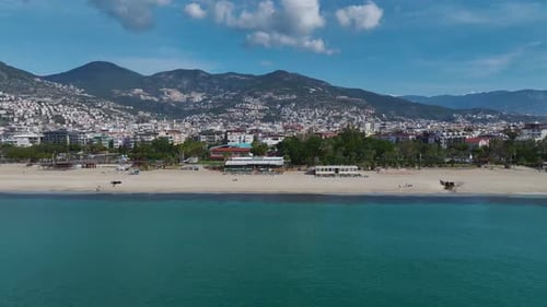 Aerial Video of a Remote White Sand Beach With Clear Blue Water Small Waves and a Serene Natural