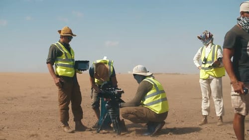 Film crew in the desert on the set of the film. Sandstorm. Strong wind