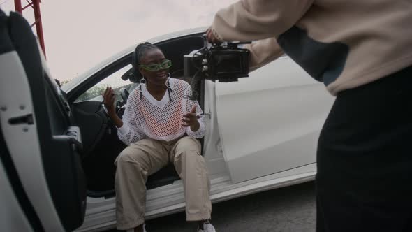 Videographer Recording Female Hip-Hop Artist Rapping in Modern Car ...