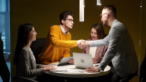 Business People Negotiate Reach Successful Agreement By Shaking Hands in Office Office Workers