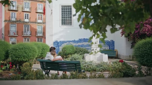 Romantic Pair Embracing Tenderly Sitting Park Bench Back View Love Concept