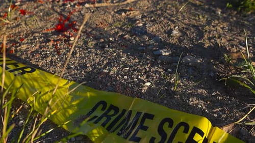 Crime Scene Tape and Evidence Marker on Ground