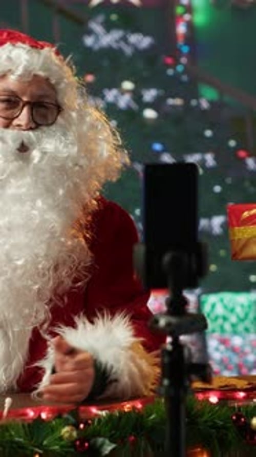 Vertical Video Saint Nicholas Dressed in His Red Suit Filming a Video Diary in His Cabin