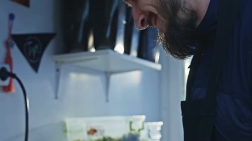 Chef Cooking Vegetables and Meat in Wok Pan