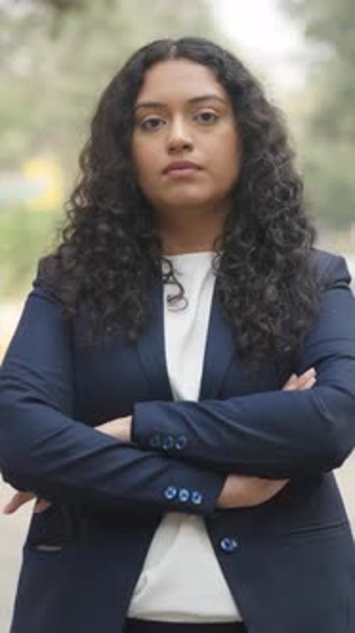 Vertical Video of Confident Curly Hair Indian Businesswoman