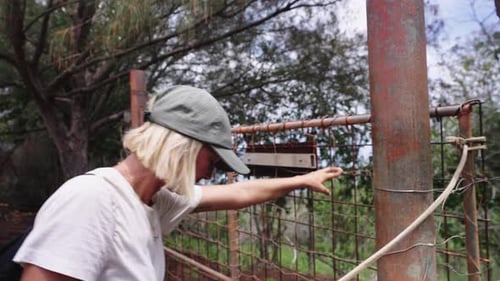 Adventurous Female Traveler Opens Gate To Earthy Trail