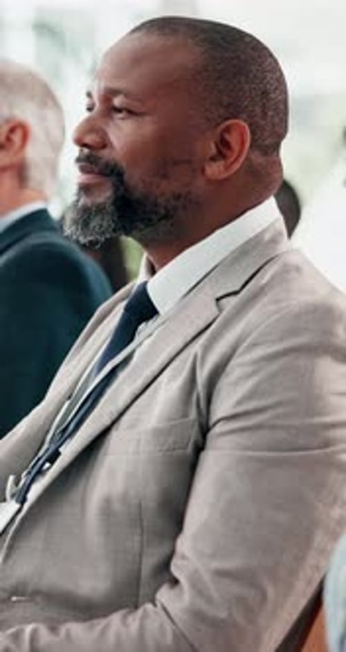 Business Professionals Listening Attentively at a Meeting
