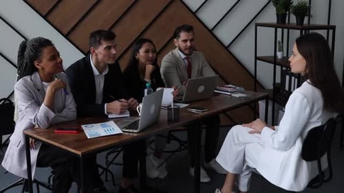 Job Interview With Diverse Panel in Modern Office