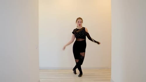 Young Woman Dancing in Black Outfit