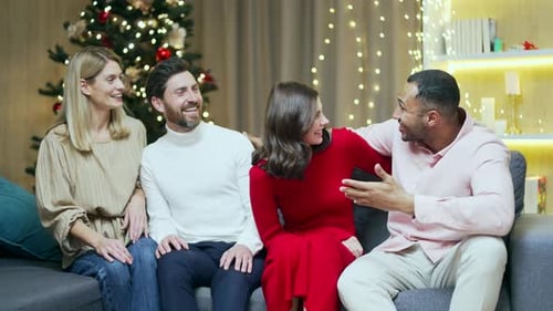 Friends Celebrate Holiday Together By Decorated Christmas Tree