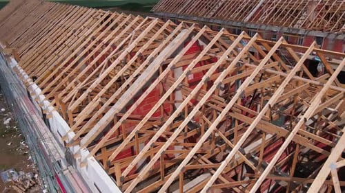 Aerial View of New Home Under Construction With Truss Roof