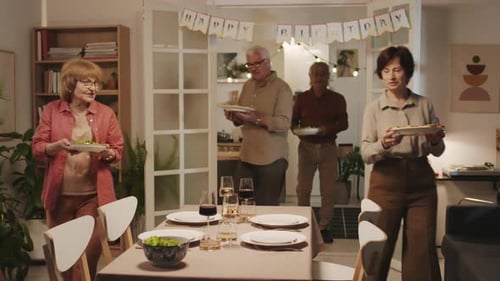 Adults Preparing Food for a Birthday Dinner at Home