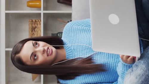 Attractive Woman Works at Home Using Laptop Computer Freelancer or Student Has Online Conversation