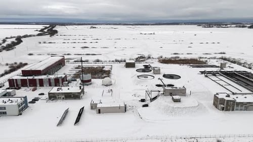 Snow Covered Wastewater Treatment Plant Aerial