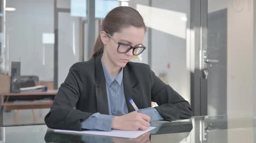 Young Adult Woman Working in a Modern Office