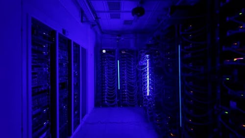 Multiple servers with flashing red lights in a data center