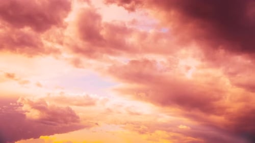 Pink Clouds Moving in Sunrise or Sunset Sky