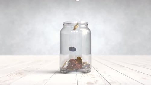 Financial Growth: Coins Filling a Glass Jar