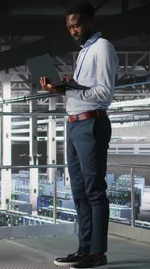 Vertical Video Data Center Coworkers Use Laptop to Monitor Neural Network LLM Visualization