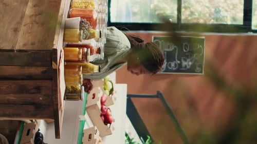 Woman Shops for Colorful Dried Peppers in Pantry